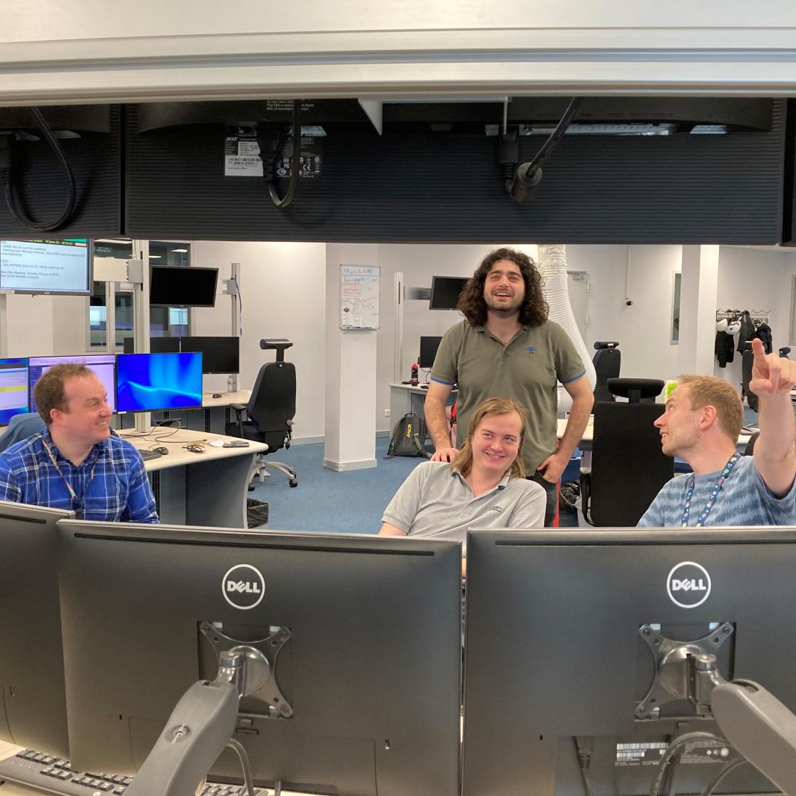 Controlroom of LHCb under Maastricht control from left: Chris Pawley, Davide Nicotra (standing), master student Mark Waterlaat and Jacco de Vries