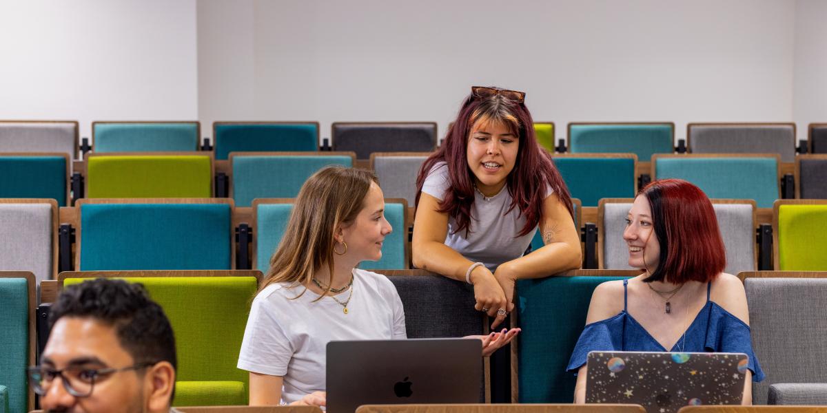 Student chatting in lecture hall