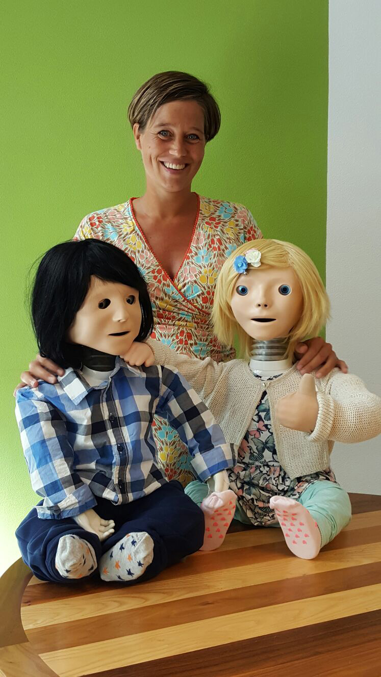 Claire Huijnen and two of her robots