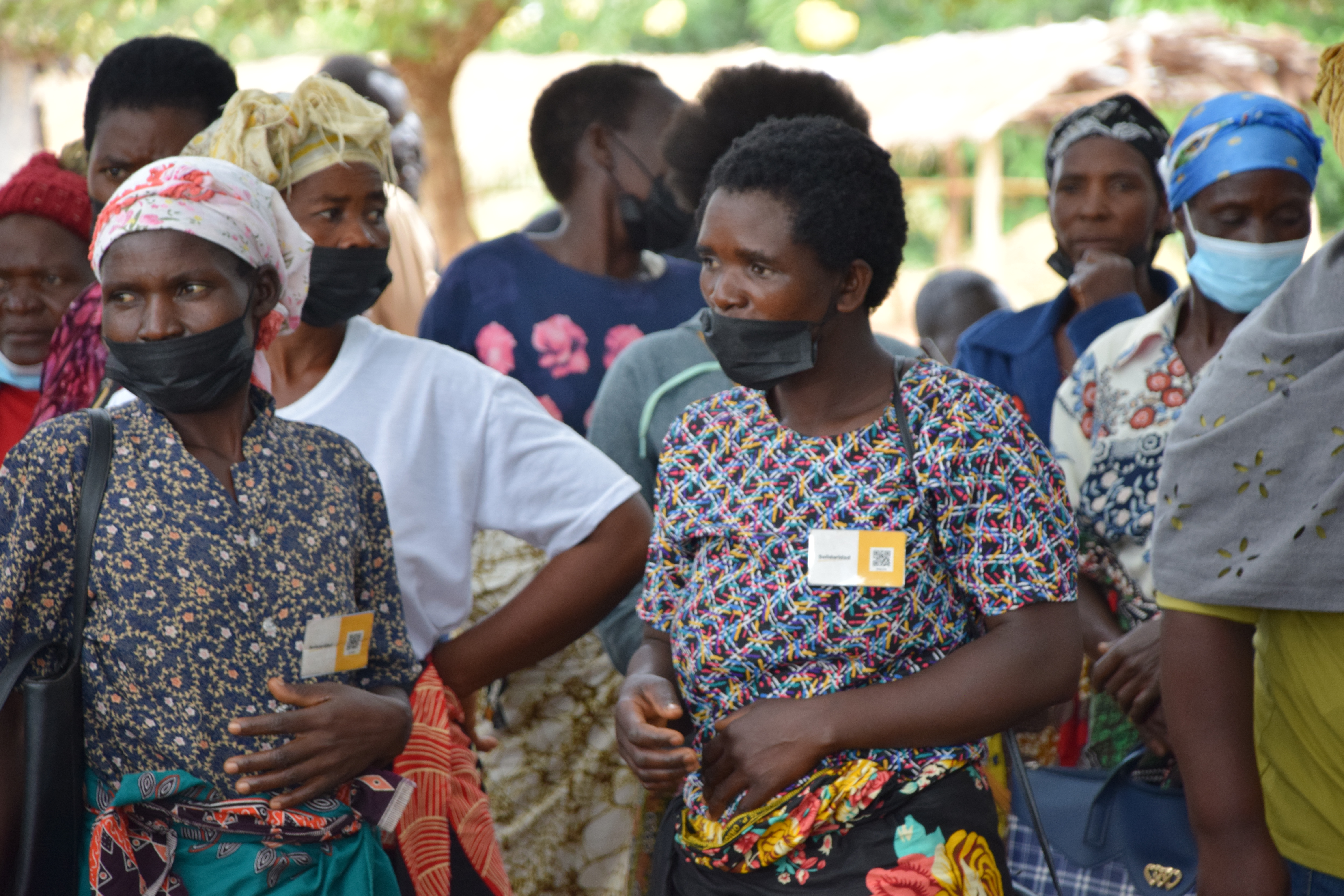 Farmers in Malawi using QR provided by Solidaridad as digital IDs.