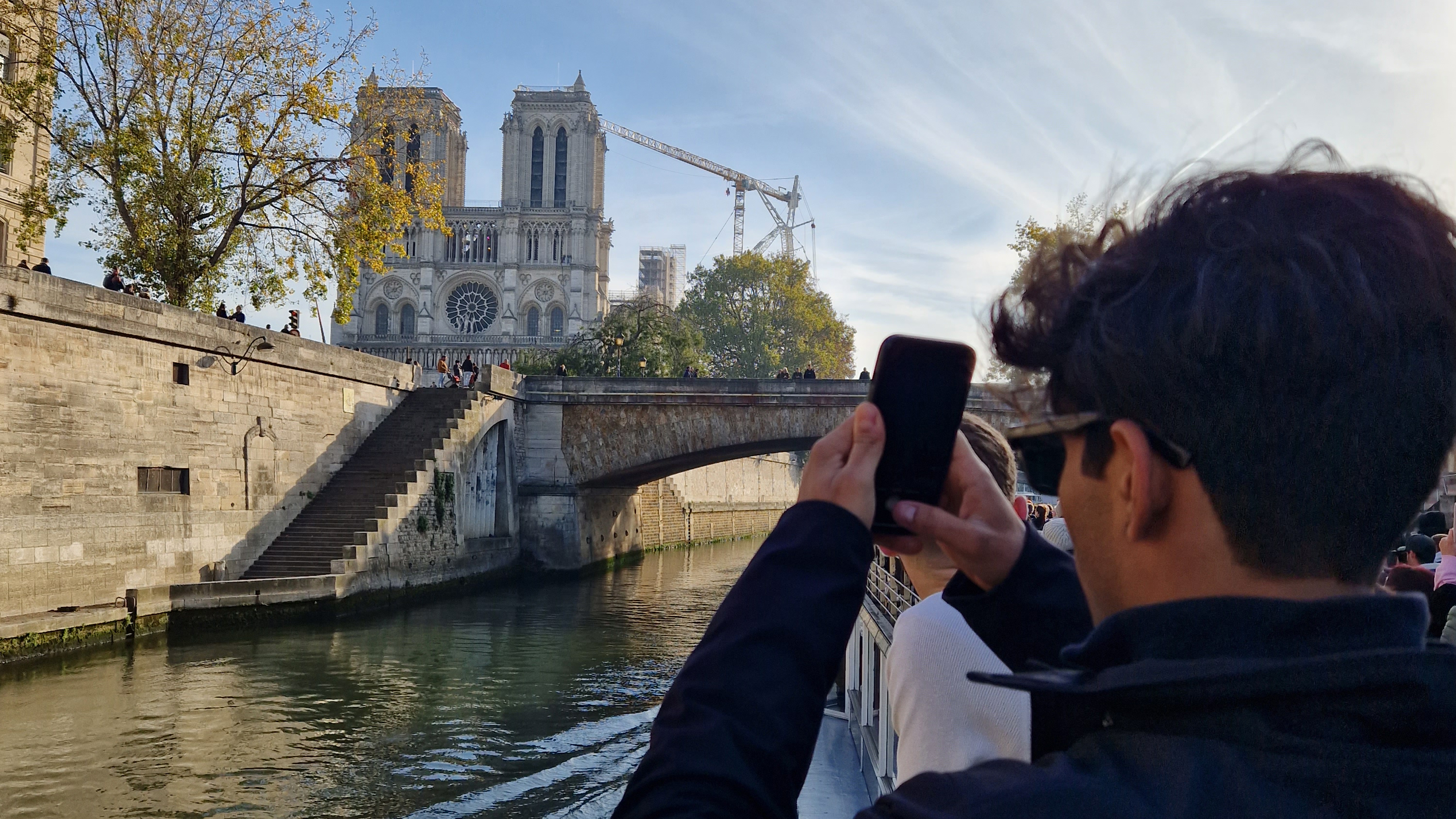 CES student taking a photo of the Notre Dame in Paris