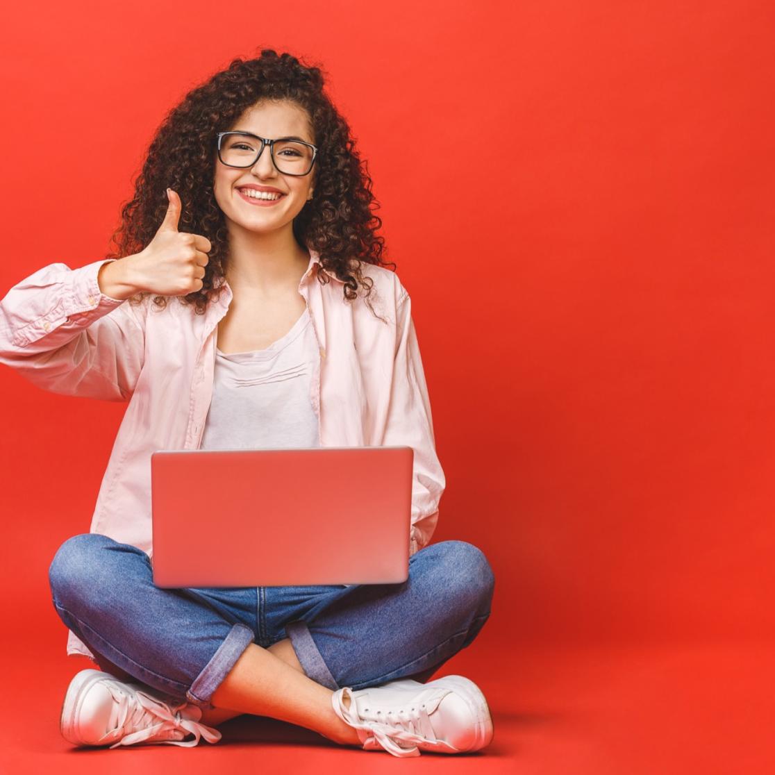 Highschool panel girl with laptop and thumbs up