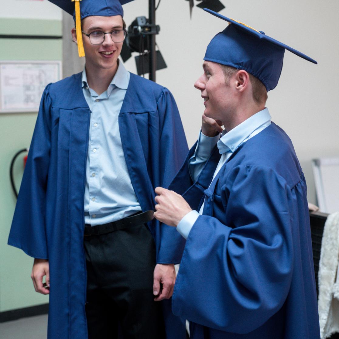 Teun van Rossum and Thijs Vogely in their graduation gown