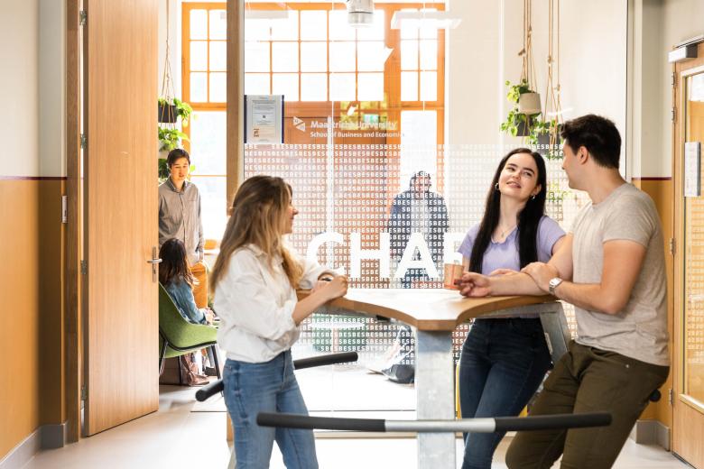 Students standing at table