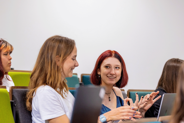 Students having a casual conversation in class