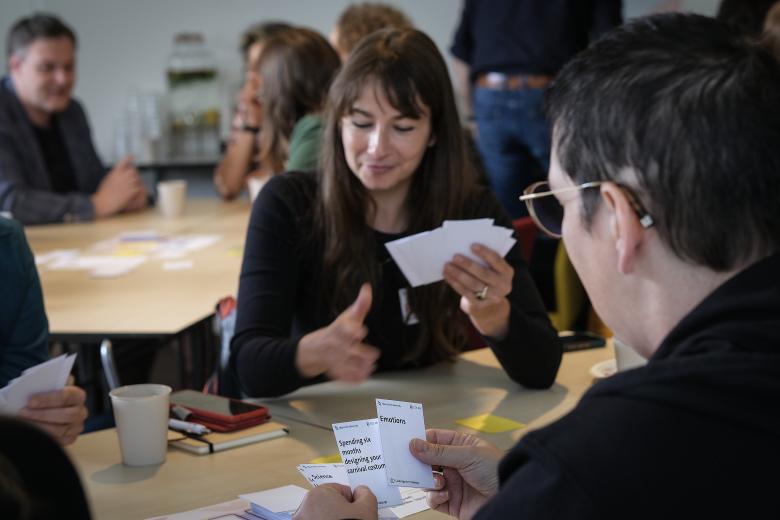 Participants playing cards against pedagogy game during UM Education Days 2024